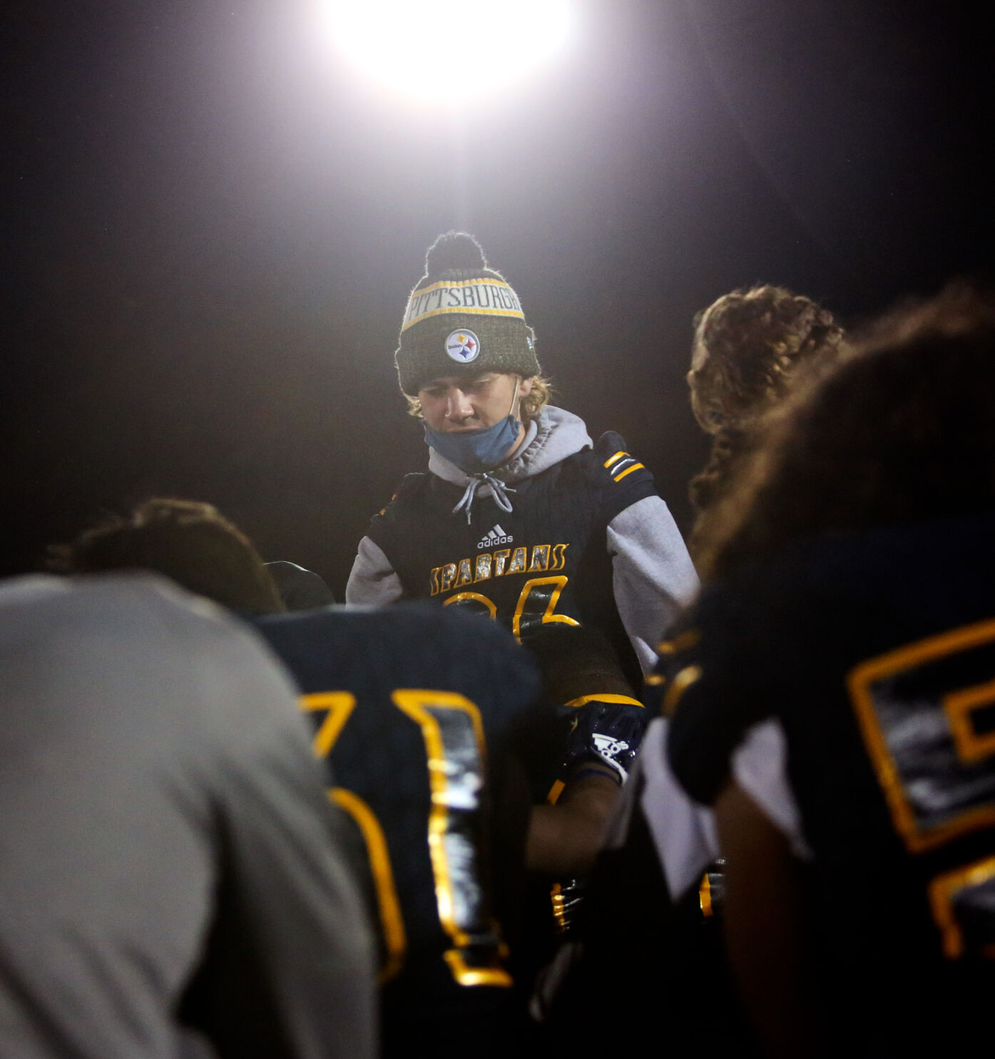 Battle senior Braden Ambra leads the Spartans in a prayer